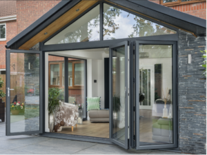 Precision-engineered bi-fold doors creating a seamless, light-filled connection between home and garden.